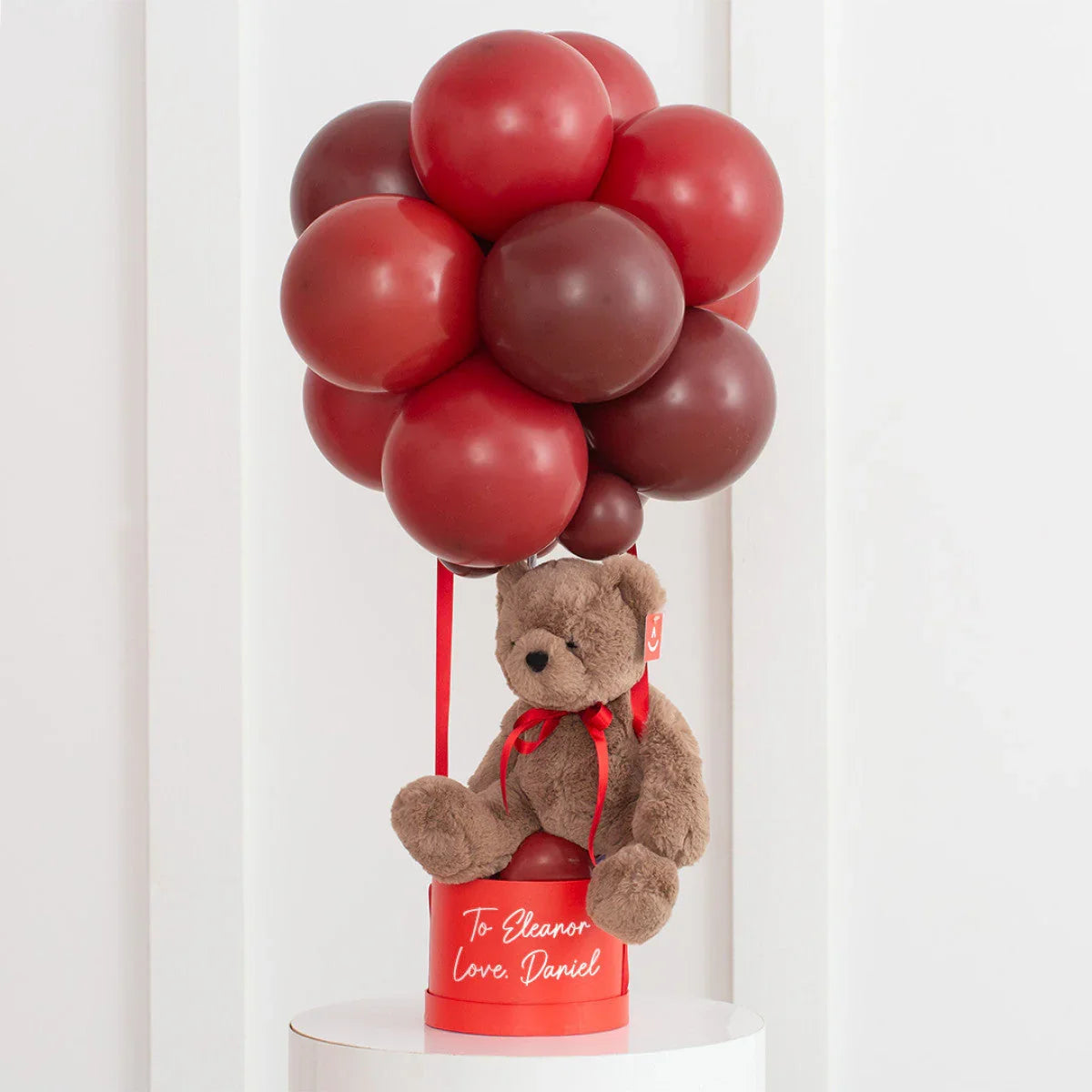 Personalized dark cherry red balloon bouquet with teddy bear and gift box, love message included
