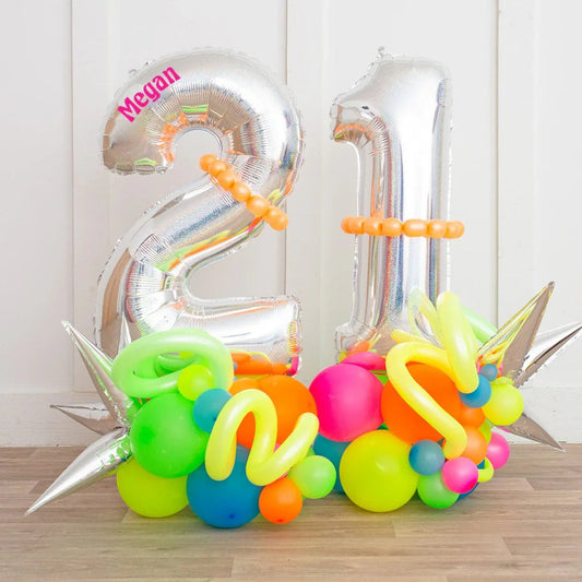 Personalized silver foil balloon numbers 2 and 1 with colorful balloon decorations, name Megan on 2