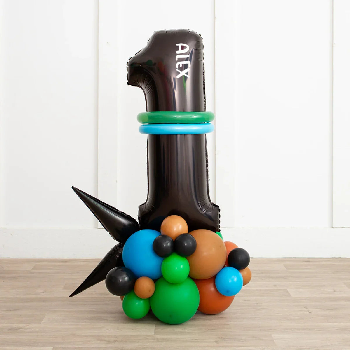 Personalized black number 1 balloon with name Alex and colorful blue, green, brown balloon cluster