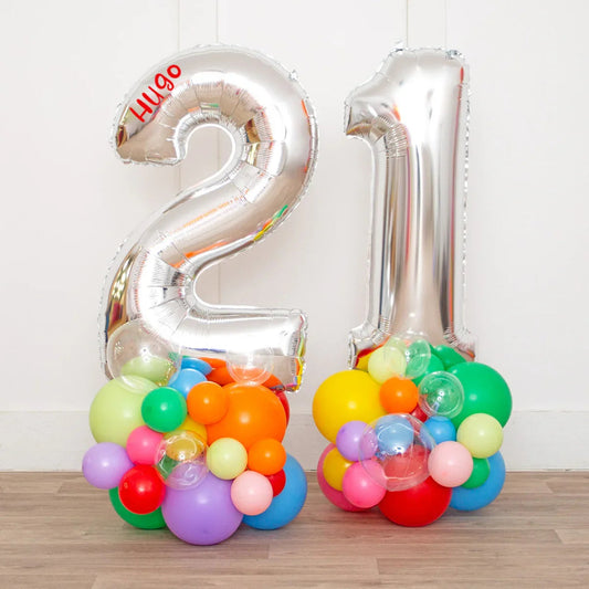 Silver foil number 21 balloons with colorful rainbow bubble clusters and personalized name Hugo
