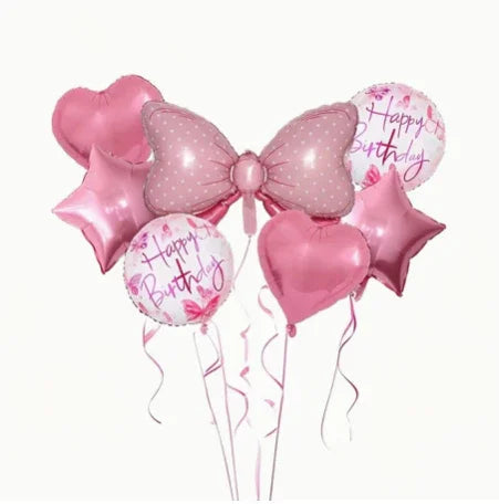 Pink bow-shaped birthday balloon with heart, star, and Happy Birthday balloons for celebration