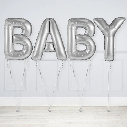Silver foil letter balloons spelling BABY, decorated for baby shower or celebration