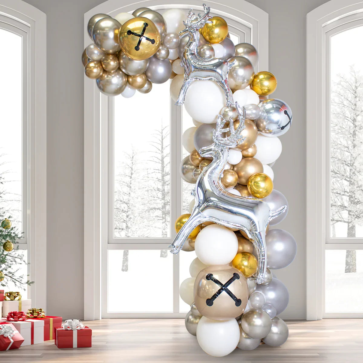 Asymmetric Christmas balloon arch with gold, silver, white balloons and silver reindeer in festive room