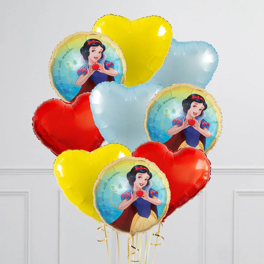 Snow White themed foil balloons with red, yellow, and blue heart-shaped balloons in a white room