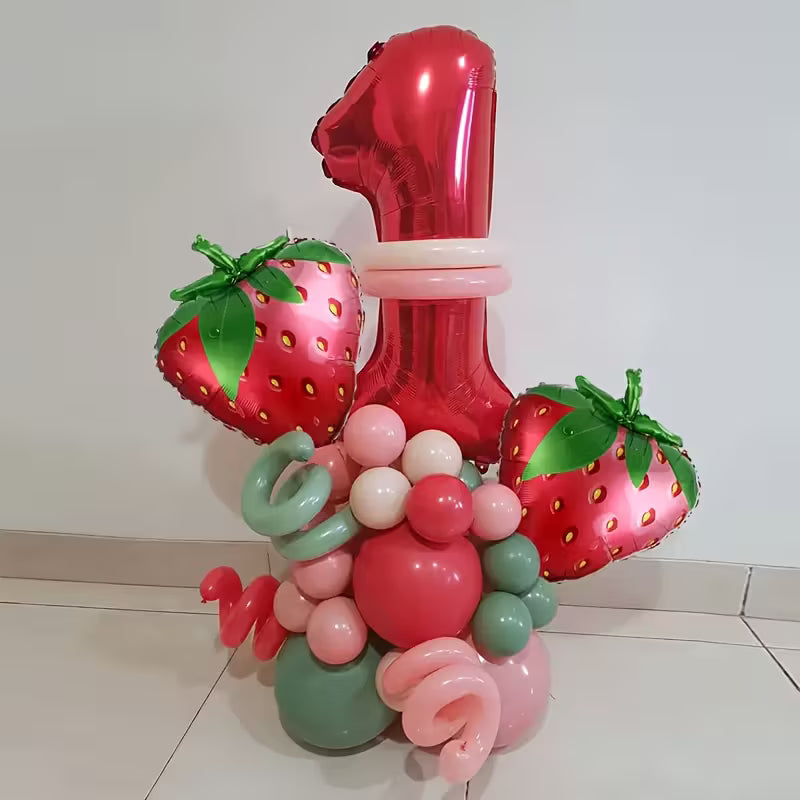 Red foil balloon shaped number 1 with strawberry-shaped balloons and pastel pink, green, and red latex balloons