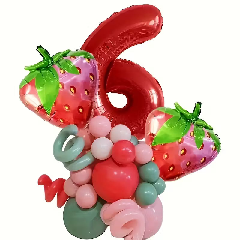 Red foil balloon shaped number 6 with strawberry-shaped balloons and pink and green decorative balloons