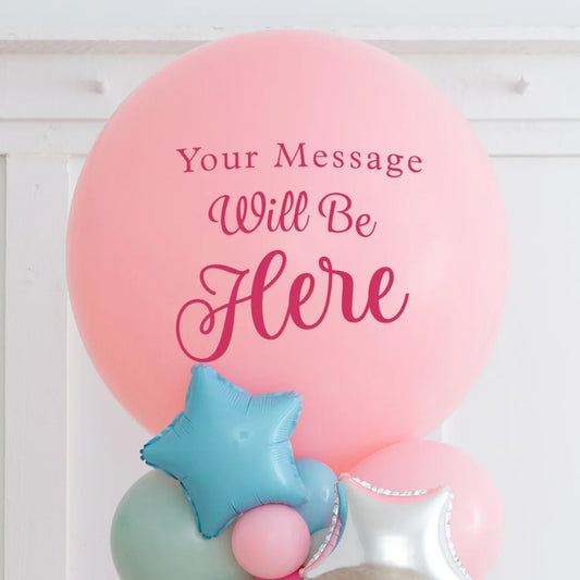 Large pink balloon with 'Your Message Will Be Here' text, surrounded by blue star and silver star balloons