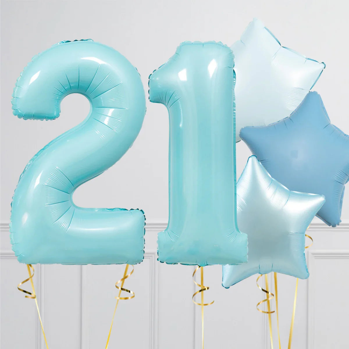 Blue foil balloons shaped as number 21 with blue and silver star-shaped balloons for birthday celebration