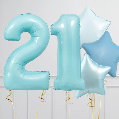 Blue foil balloons shaped as number 21 with blue and silver star-shaped balloons for birthday celebration