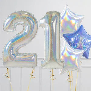 Silver foil balloons shaped as number 21 and star-shaped balloons with Happy Birthday text