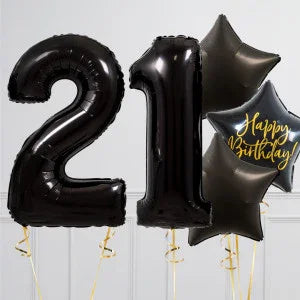 Black foil balloons shaped as number 21 and star-shaped balloons with Happy Birthday text on white background