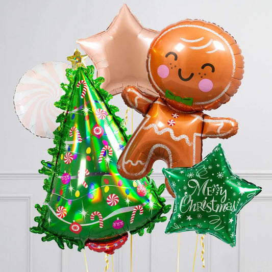 Festive Christmas balloons including a gingerbread man, green tree with candy, star shapes, and "Merry Christmas" text