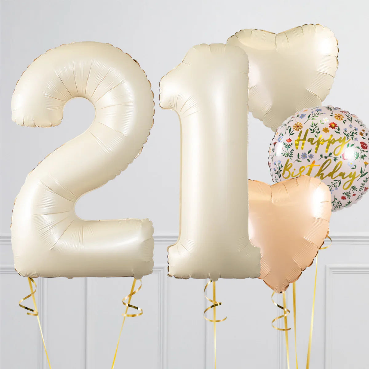 Cream colored foil balloons shaped 2 and 1 with heart shaped and floral happy birthday balloons