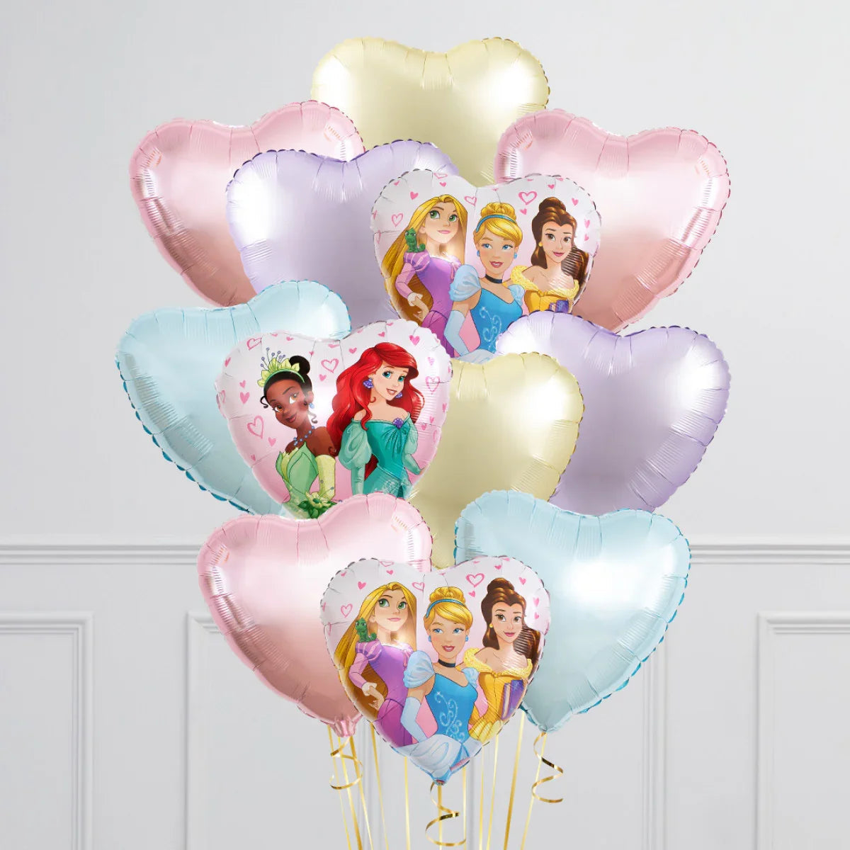 Heart-shaped pastel balloons featuring Disney princesses in a white room background