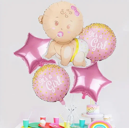 Pink and gold baby girl gender reveal balloons including baby, round 'It's a Girl' and star shapes above party table