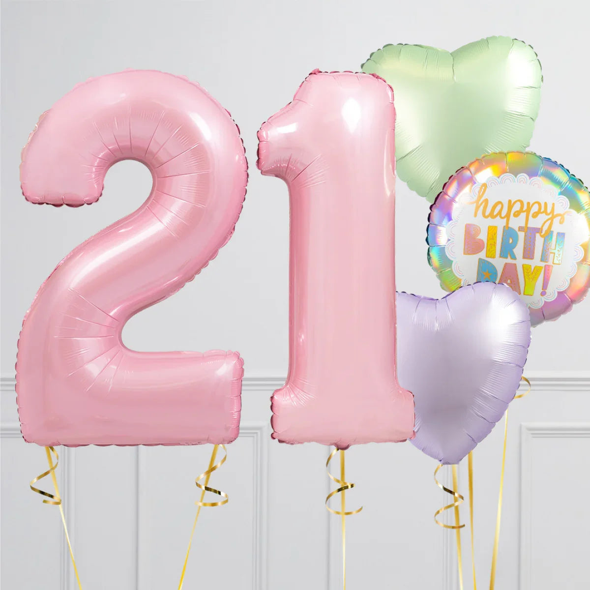 Pink number 21 balloons with pastel heart and happy birthday foil balloons on white background