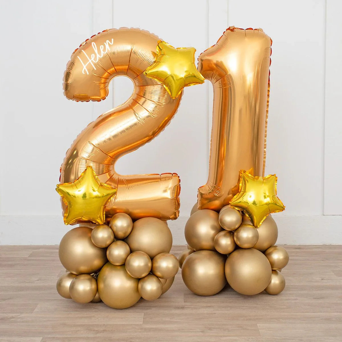 Gold chrome balloons forming number 21 with star accents and personalized name Helen