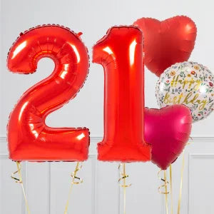 Red foil balloons shaped as number 21, with heart-shaped and happy birthday balloons in white and pink