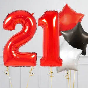Red number 21 balloons with red, black, and white star-shaped balloons on white background