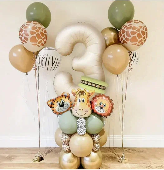Safari-themed balloon arrangement with number 3, animal faces, and giraffe-print balloons for kids' birthday