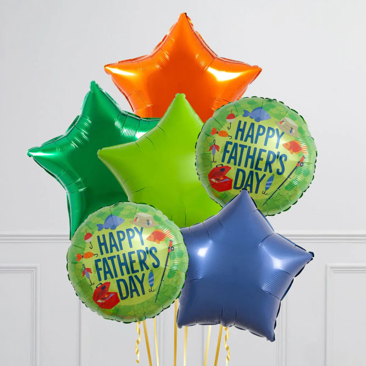 Colorful star-shaped and Happy Father's Day balloons in orange, green, blue, and lime green indoors