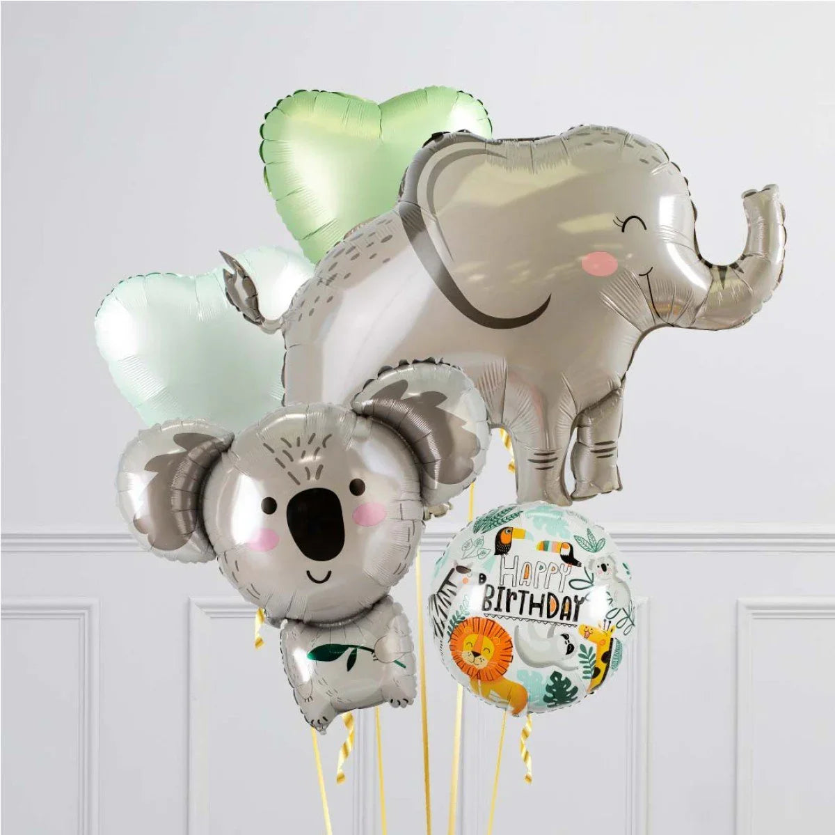 Happy birthday balloon bouquet featuring koala, elephant, heart-shaped, and animal print balloons