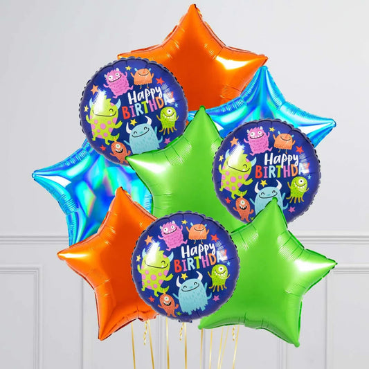 Colorful helium balloons with happy birthday monster design and star-shaped balloons in orange, green, blue
