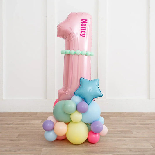 Personalized pink number 1 balloon with mint balloons and blue star balloon on pastel balloon cluster