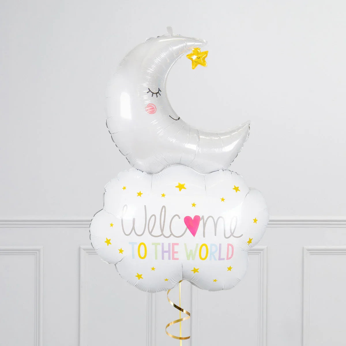 Silver moon and white cloud balloon with Welcome to the World text and yellow stars on wall background