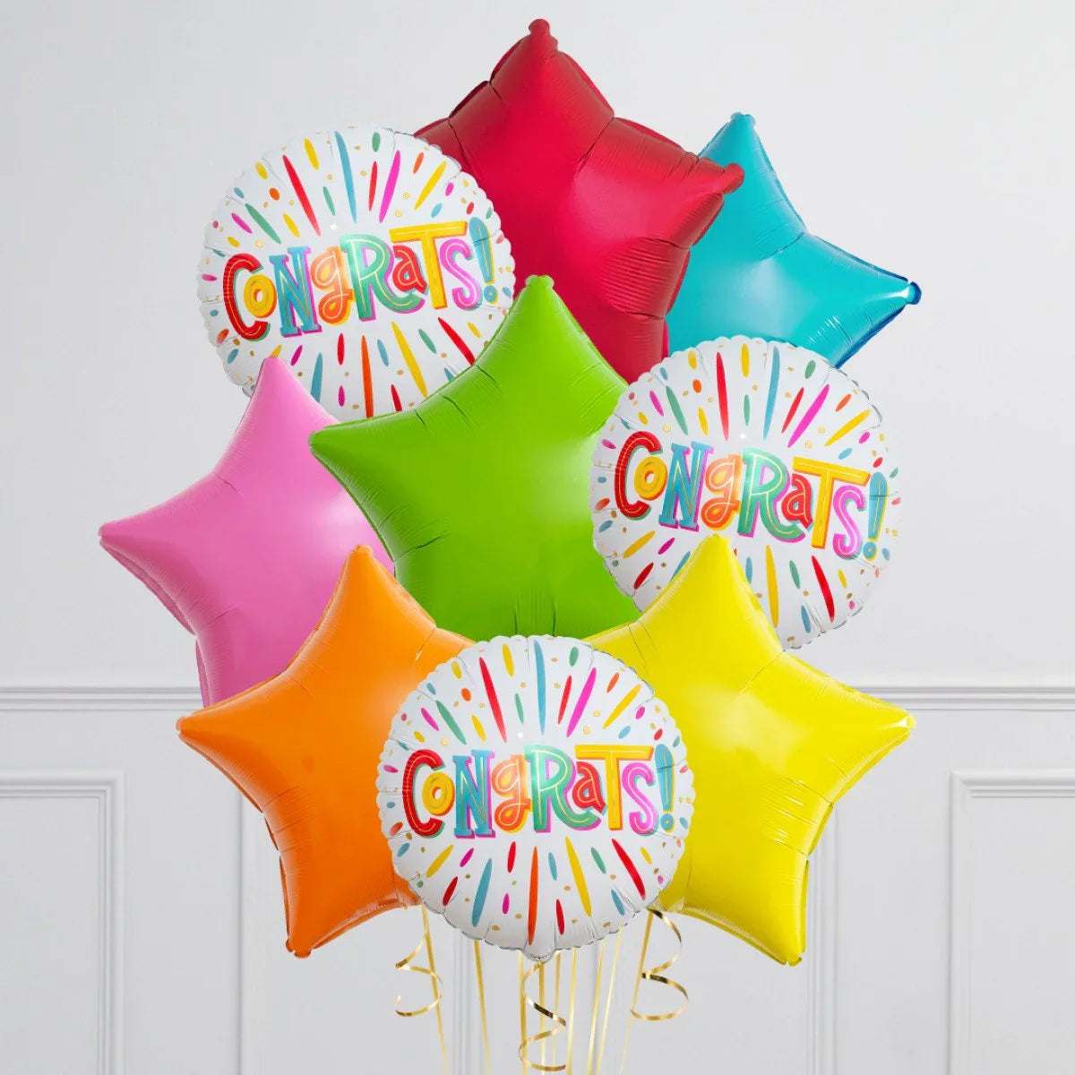 Colorful Congrats foil balloons bouquet with star-shaped balloons in red, blue, green, pink, orange, and yellow