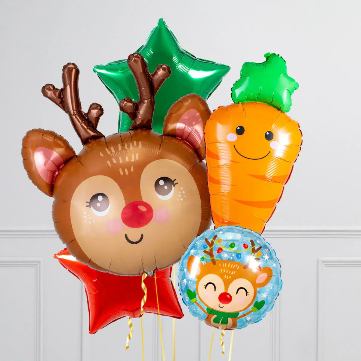 Christmas balloons featuring a smiling reindeer, green and red stars, a happy carrot, and a festive round reindeer design