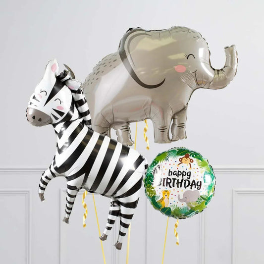 Safari-themed birthday balloons featuring a smiling zebra, elephant, and jungle animal round balloon