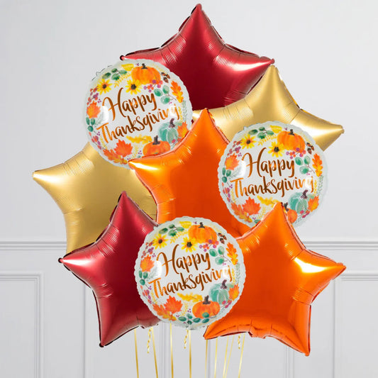 Thanksgiving balloons with colorful star-shaped and round Happy Thanksgiving designs with autumn leaves